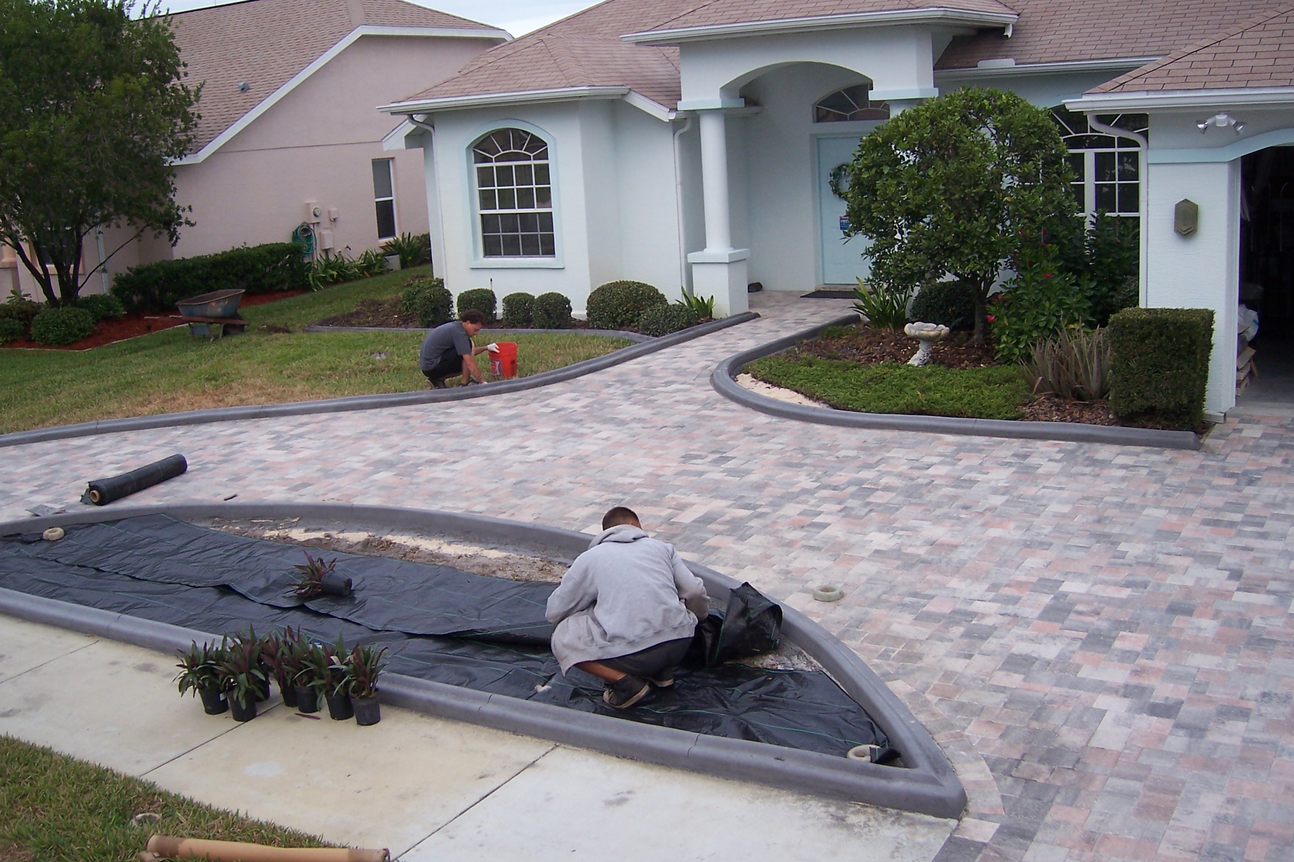 Professionals from Curb Appeal Curbing hard at work